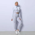 Light gray form-fitting two-piece workout set with seamless sport ribbed knit fabric and black zipper detail from 3pcs yoga set