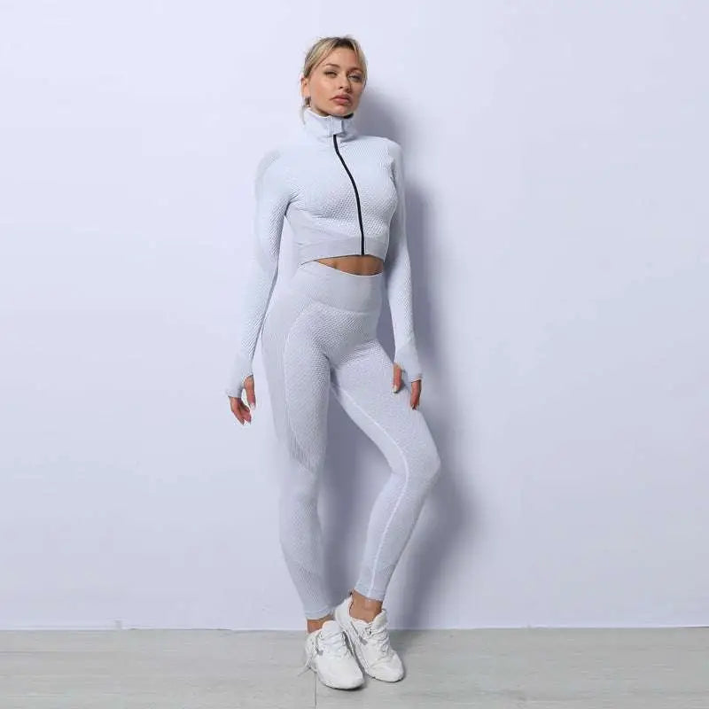 Light gray form-fitting two-piece workout set with seamless sport ribbed knit fabric and black zipper detail from 3pcs yoga set