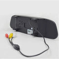 Black rearview mirror with matte finish and threaded mounting brackets featuring a reversing camera black lens