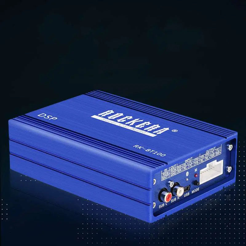 Blue rockera rk-bt100 dsp audio processor with silver trim and labeled ports back side of 4 channel car audio amplifier