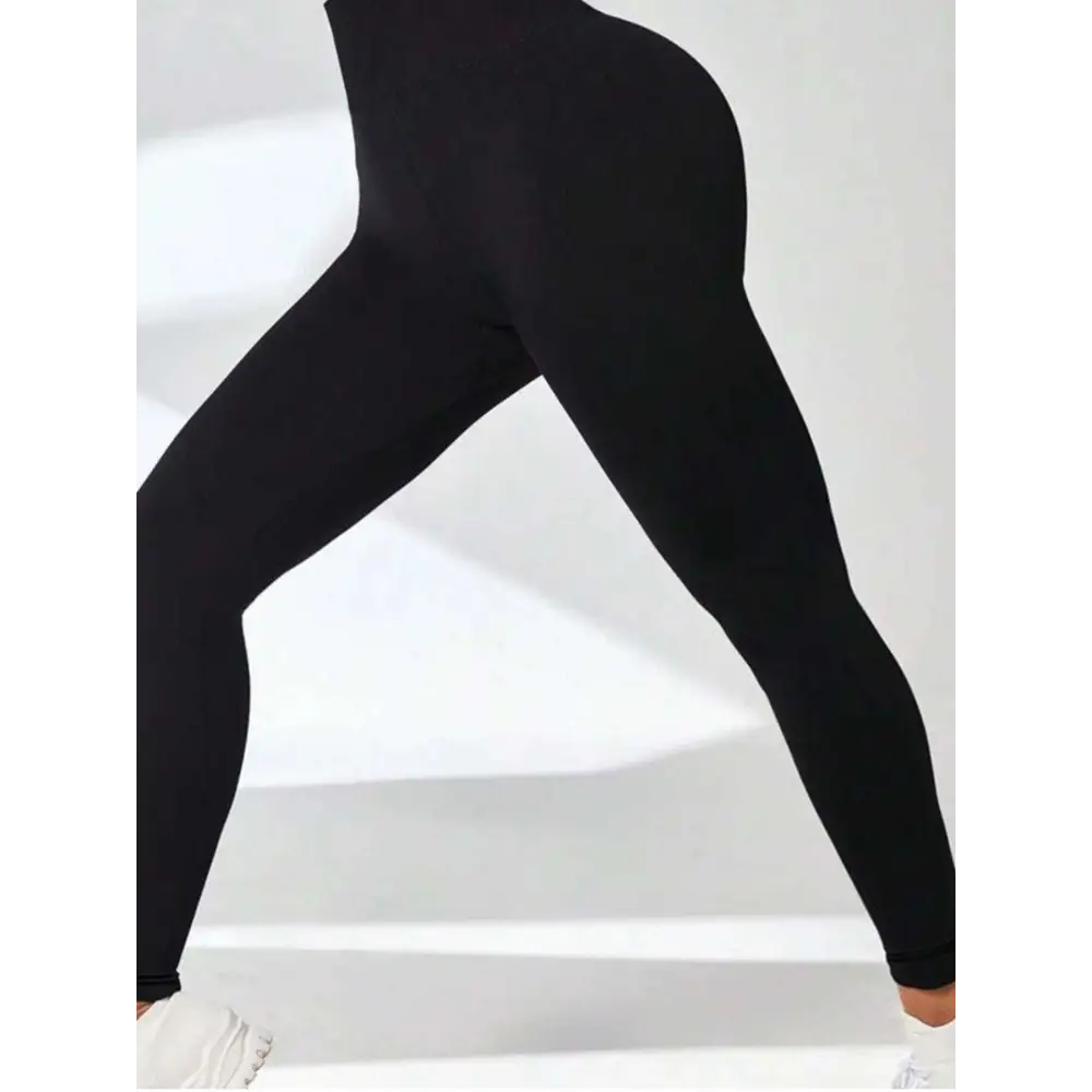 Black high-waisted leggings with smooth stretch fabric featuring tummy control butt lifting for yoga and daily wear