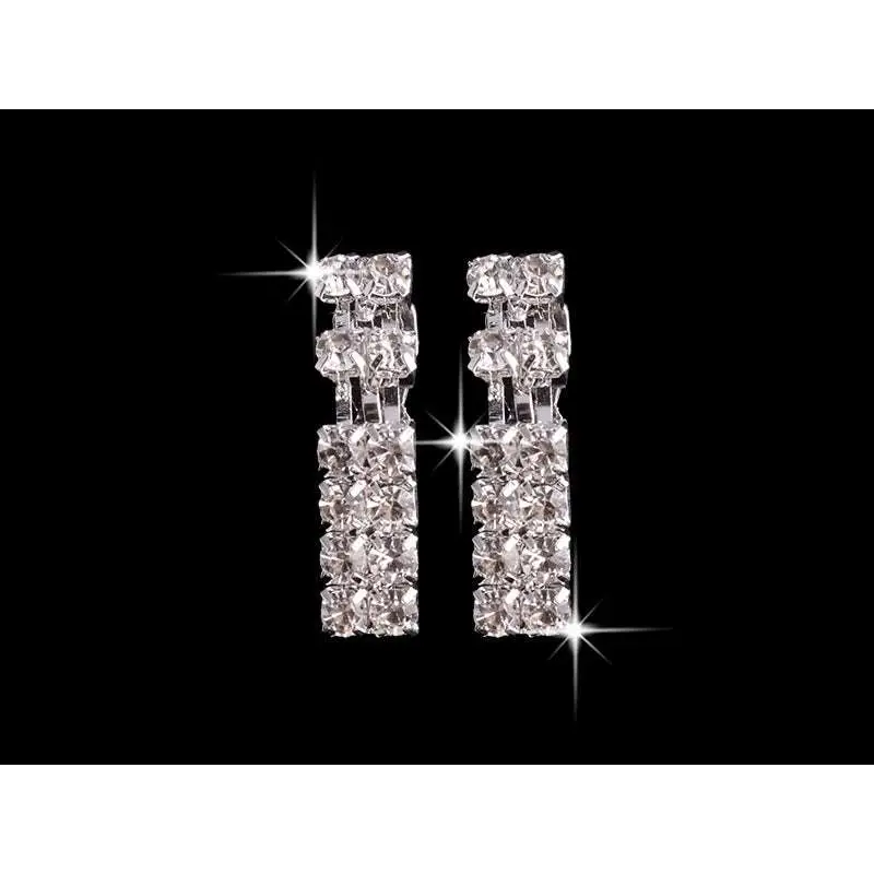 A pair of sparkling multi-tiered silver-toned geometric cascading rhinestones matching earrings from necklace set