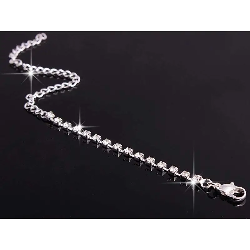 Silver chain bracelet with clear sparkling rhinestones and lobster clasp from 4 pieces rhinestones necklace set with matching earrings