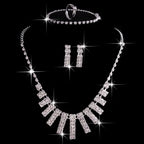 Silver 4 pieces rhinestones necklace set featuring geometric cascading rhinestones necklace with matching earrings
