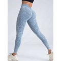 Light blue textured scrunch butt lifting workout leggings showing subtle pattern for enhanced shaping and comfort