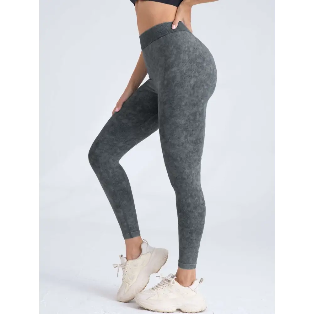 Dark gray high-waisted pieces scrunch butt lifting workout leggings with subtle textured pattern for exercise