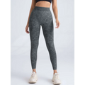 Dark gray high-waisted scrunch butt lifting workout leggings with subtle camouflage pattern and stretchy fabric
