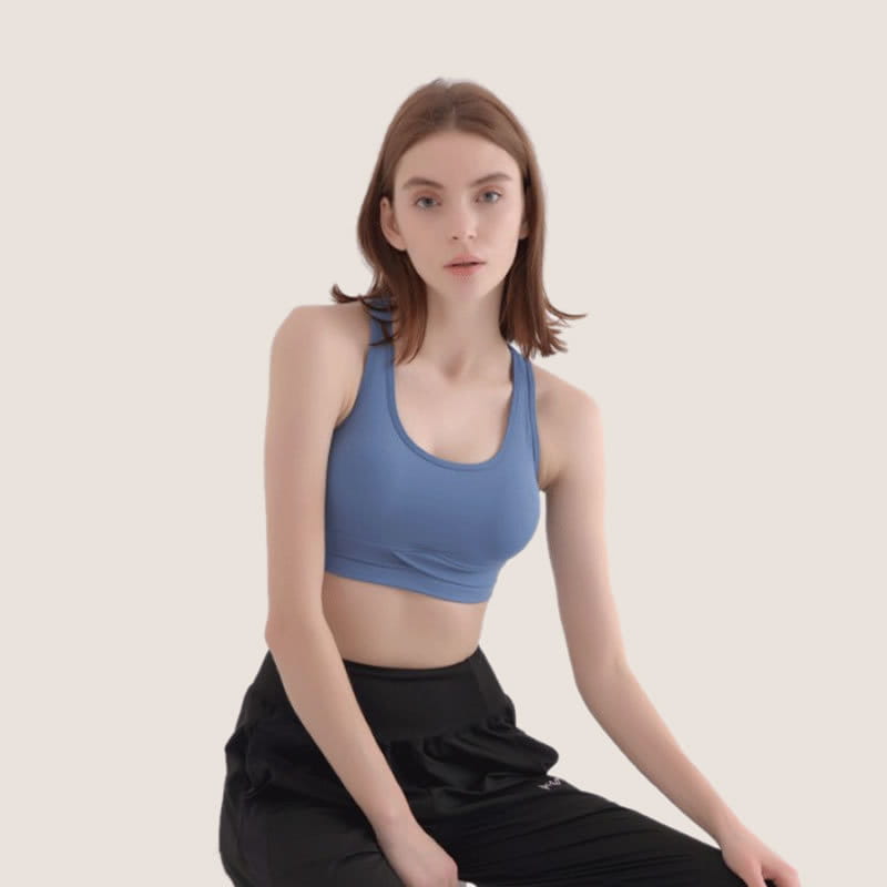 blue women’s halter yoga vest featuring a sports bra design with thin straps and a rounded neckline suitable for halter yoga practice