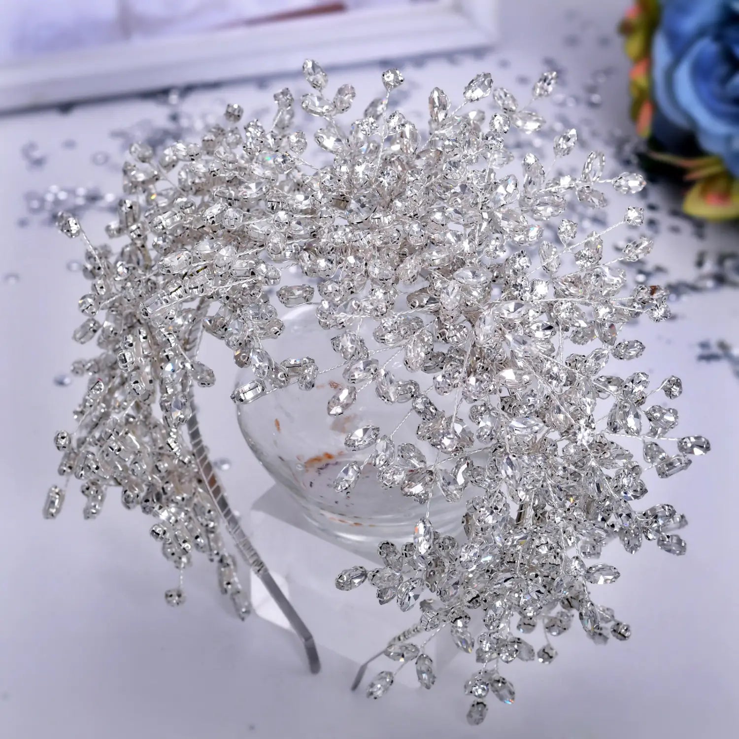 A heavy handmade rhinestone silver crystal vine headpiece with clear faceted rhinestones and delicate metallic branches for snow queen wedding use.