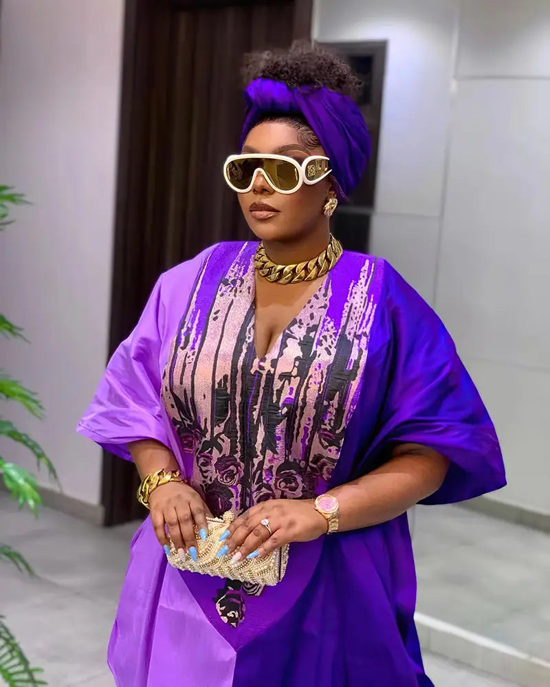 Vibrant purple satin ethnic style loose dress featuring intricate black and pink floral embroidery on the bodice.