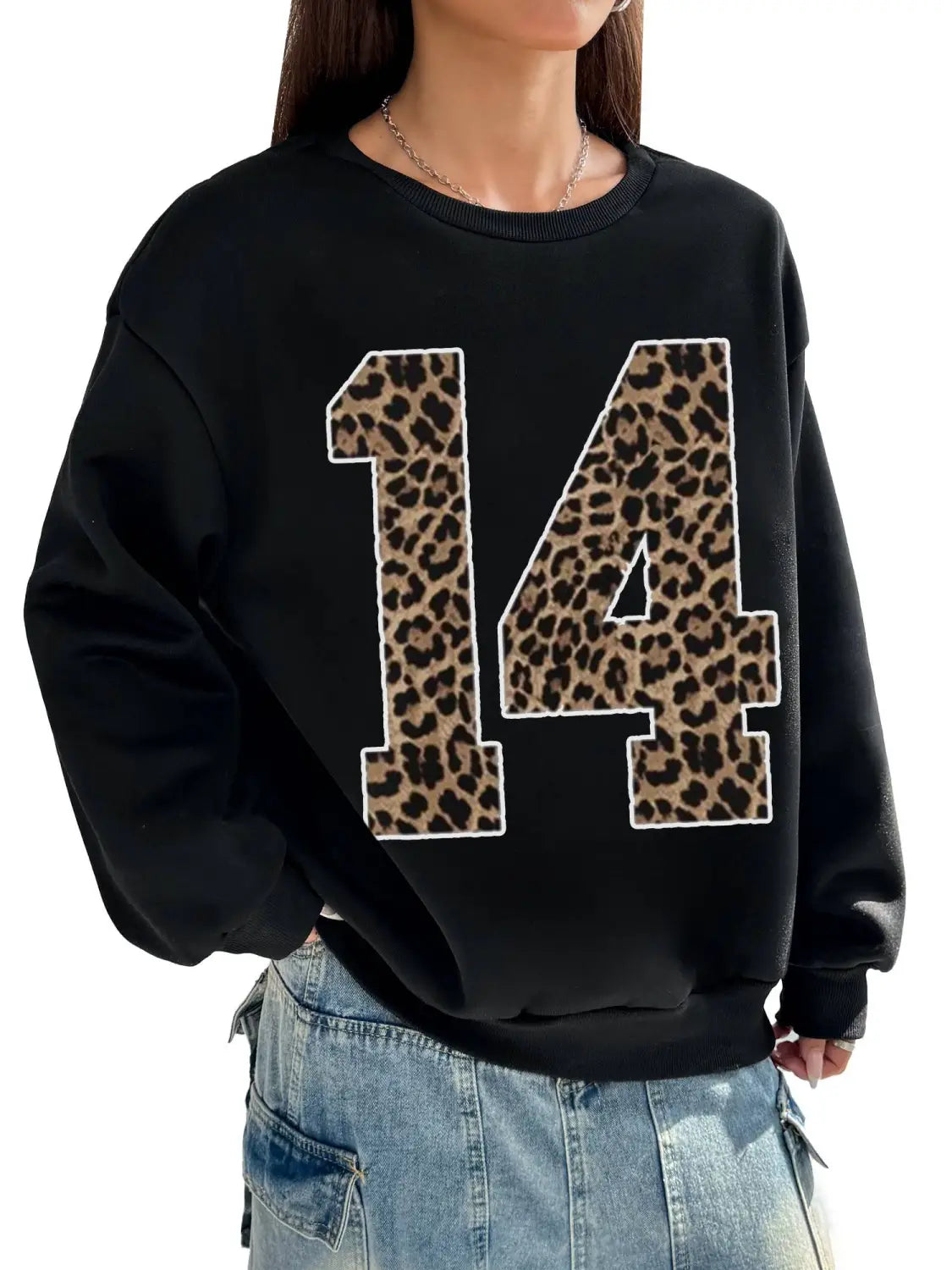 black crew neck sweatshirt featuring a bold leopard-print number 14 with white trim on the front