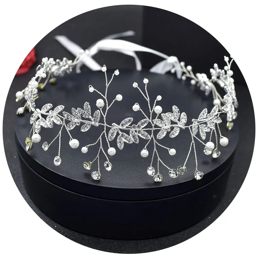 silver leaf pearl bridal hair band adorned with sparkling crystals and delicate white pearls featuring a band rhinestone alloy design inspired by silver vine.