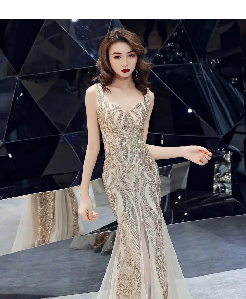 A shimmering gold and cream beaded fishtail long summer sequins sling evening dress with intricate lace detailing.