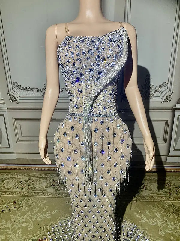 a shimmering silver beaded sexy elegant fishtail gown featuring intricate silver and purple crystal embellishments along a diagonal seam designed for an elegant evening look