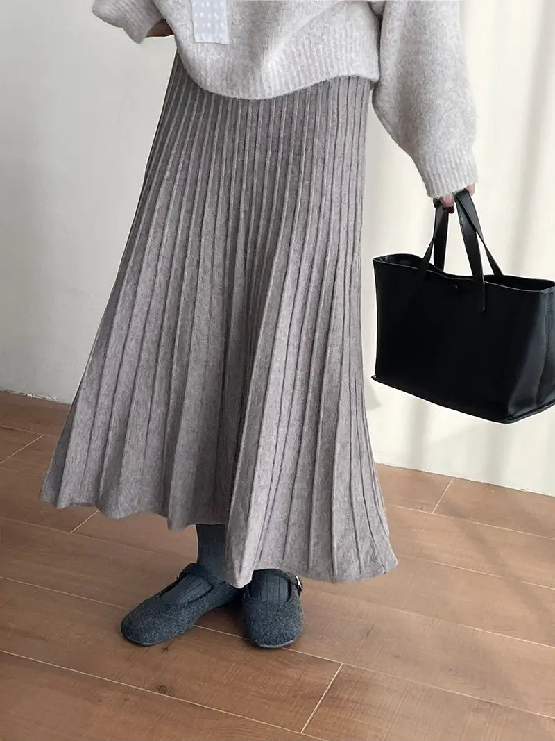Gray ribbed knit pleated midi skirt featuring a korean elastic waist for comfortable and stylish wear.