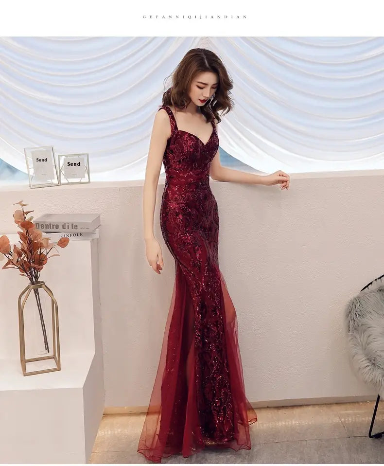 a shimmering burgundy fishtail long summer sequins sling evening dress with intricate lace detailing and a sheer overlay