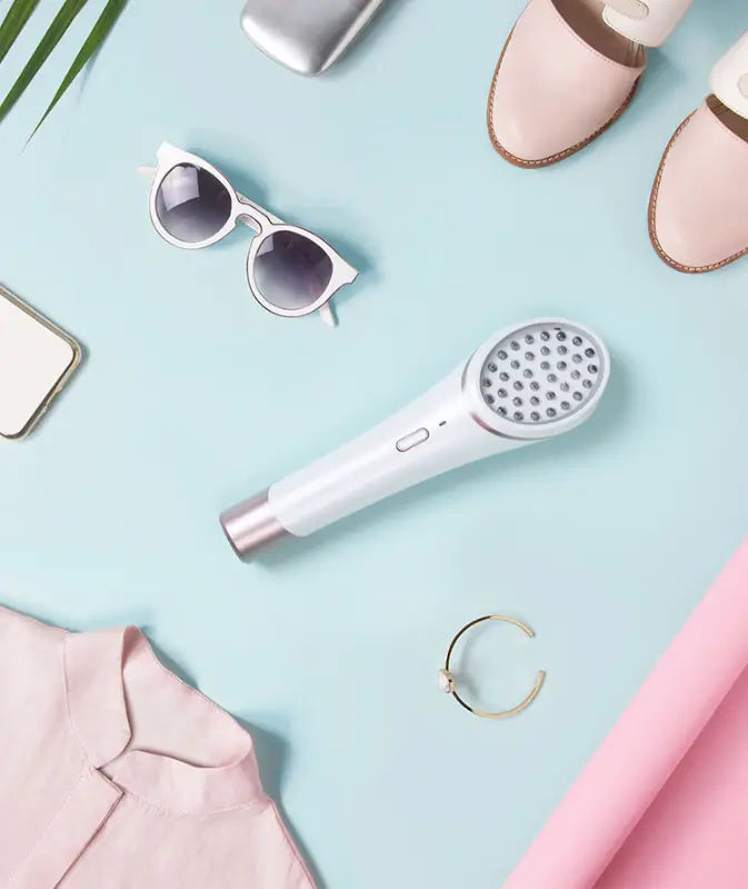 white handheld xpreen wireless blue light acne therapy device with metallic accents featuring a circular array of small lights for effective light therapy treatment