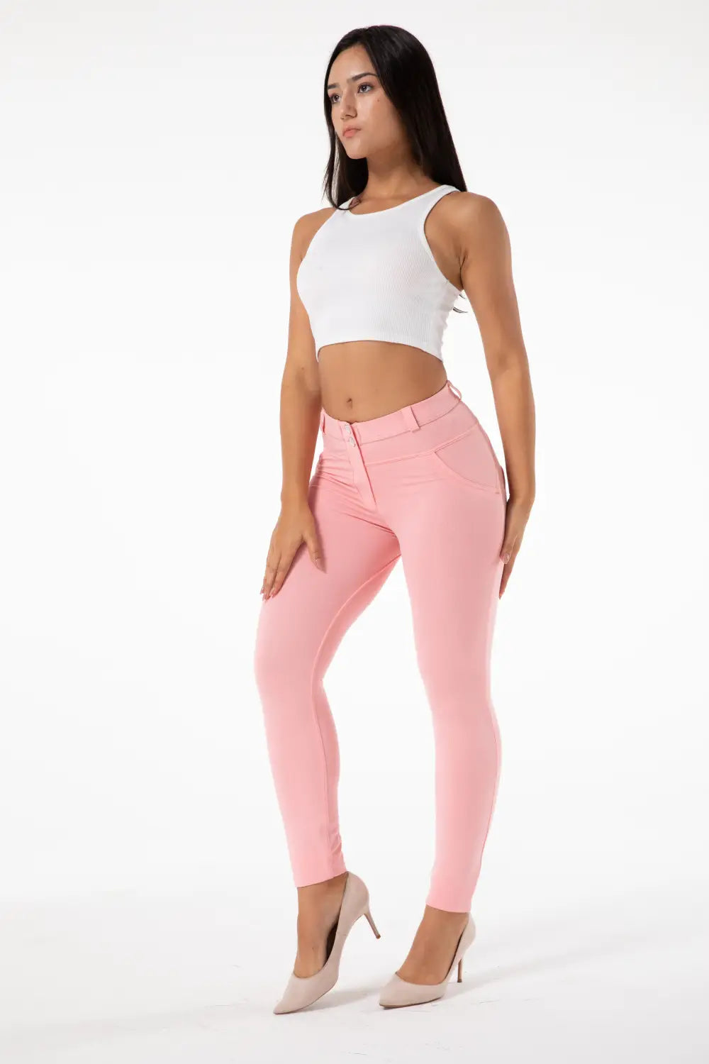 A pair of blush pink melody hot shaping leggings featuring a form-fitting high-waisted design and sleek modern style for effective hot shaping.