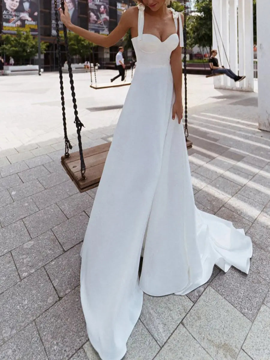 A flowing white satin wedding gown with a sweetheart neckline and thin shoulder straps featured as an ebay sexy sling foreign trade product.
