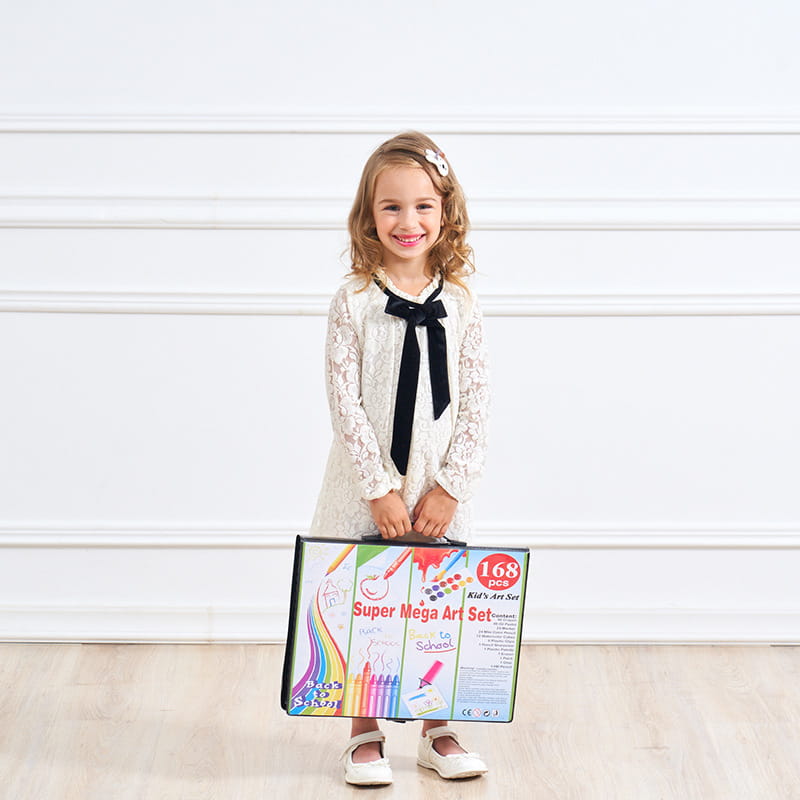 A child holding a colorful rectangular pen set box labeled super mega art set with 168 pieces featuring a comprehensive watercolor pen and painting set.
