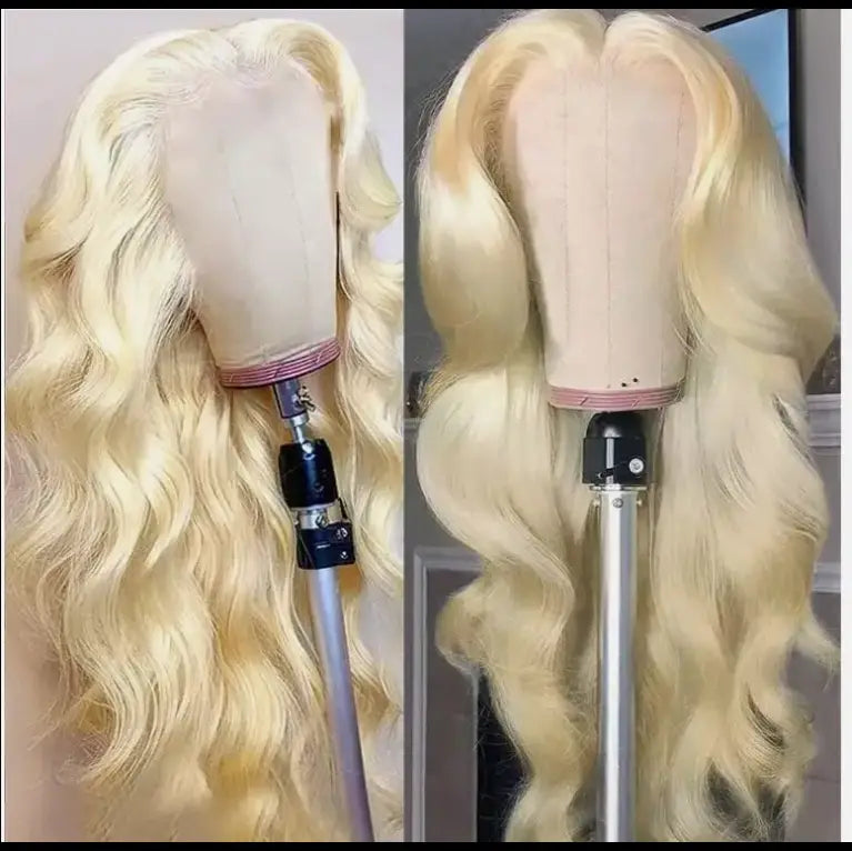 Blonde wavy lace front human hair wig displayed on a mannequin head is a 30 inch hd 13x4 hot sale blonde body wave wig.