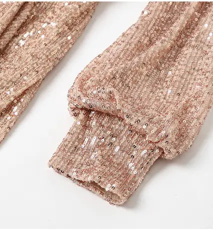 Rose gold sequined long sleeve top with ribbed cuff featured in a fantasy celebrity sexy high slit sequined evening dress.