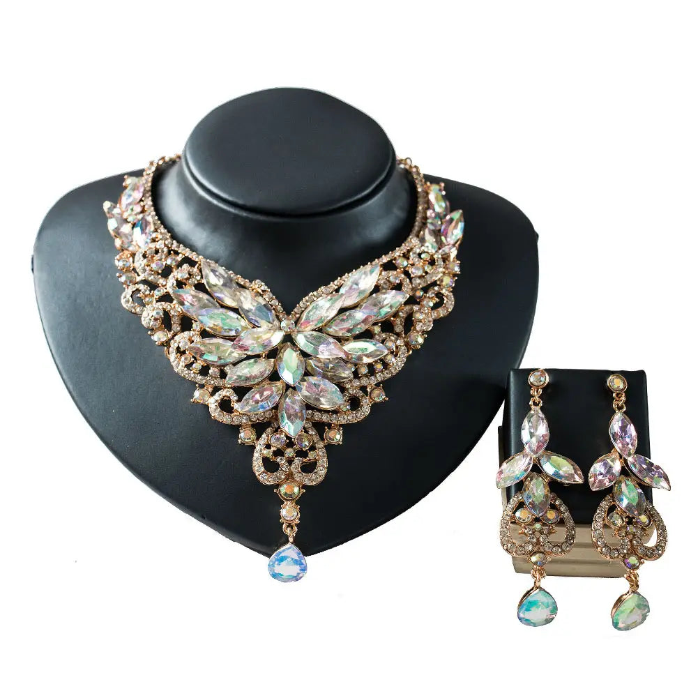 Gold-toned necklace and matching earrings set featuring intricate floral designs with iridescent multicolored crystals in the american color exaggerated bride jewelry set for color exaggerated bride occasions.