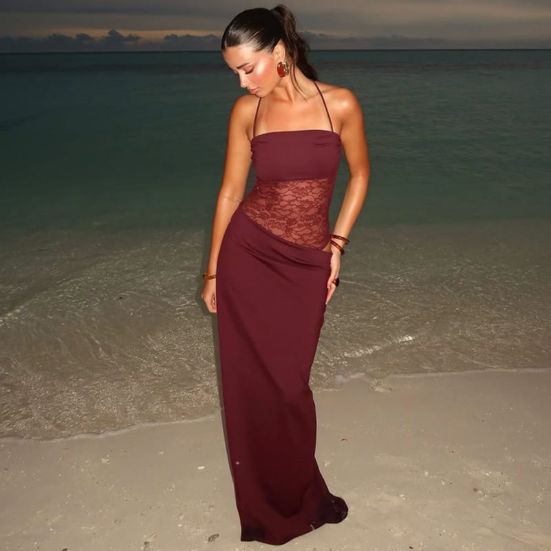 A flowing maroon strapless satin gown featuring a lace bodice and draped skirt in a burgundy satin y2k lace suspender dress.