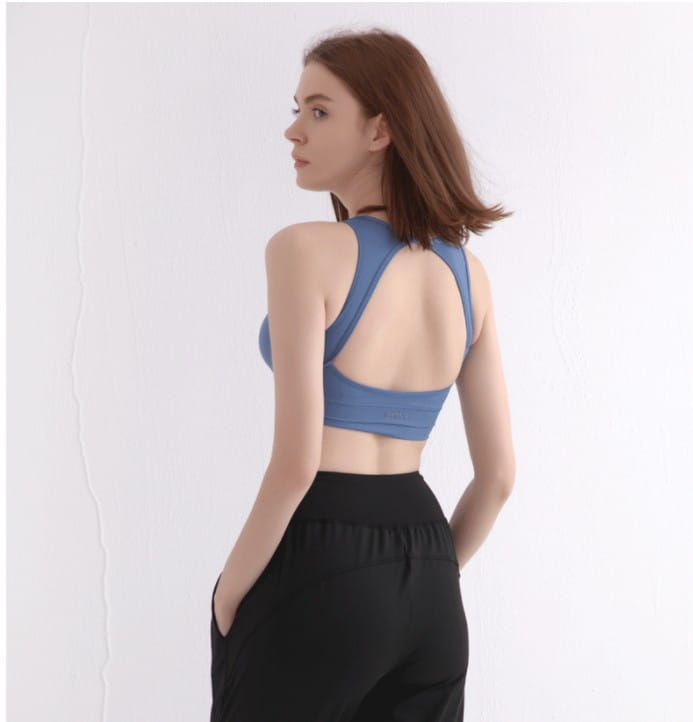 blue women’s halter yoga vest featuring a blue sports bra with a racerback design and textured fabric for comfortable halter yoga sessions