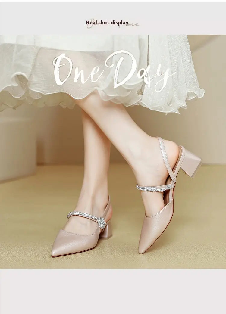 Delicate rose gold satin pointed toe high heels featuring a low chunky heel and sparkling rhinestone straps.