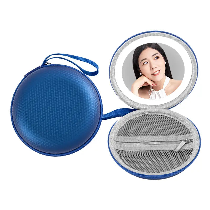 blue and silver round bag mirror case featuring a blue circular travel mirror with a textured exterior mesh interior and an integrated led light ring around the reflective surface.