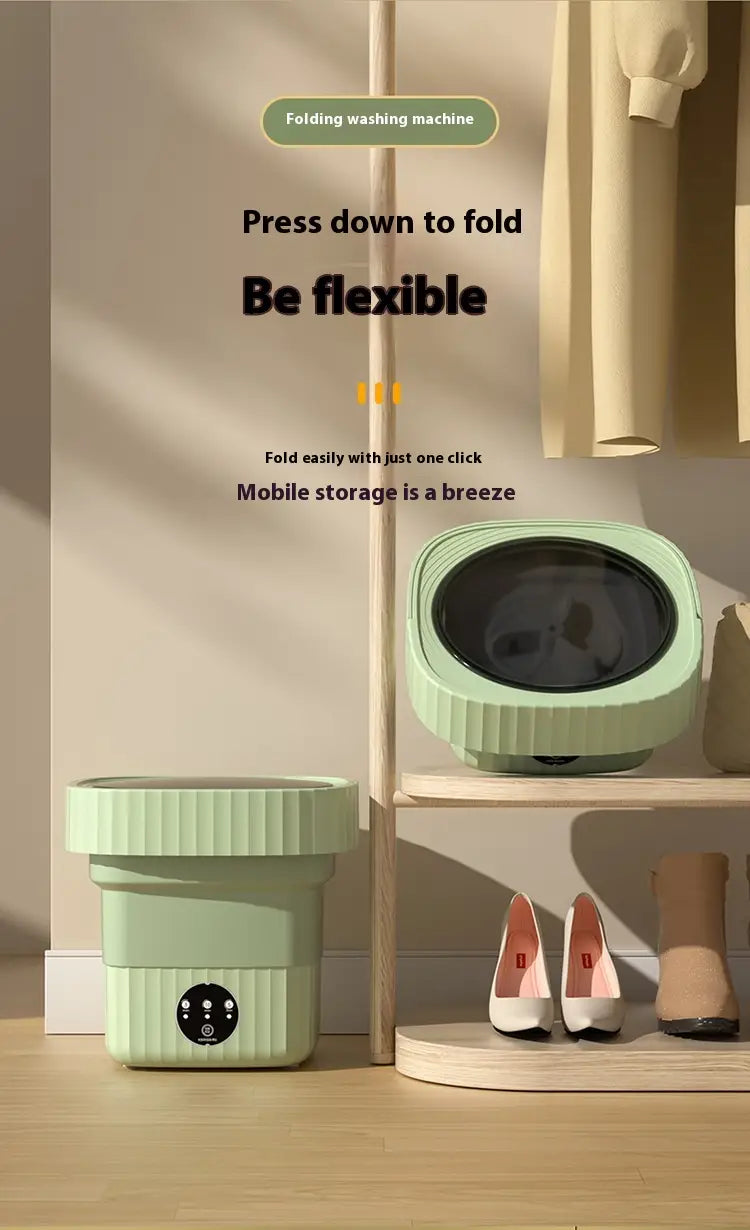 Mint green ribbed folding washing machine with a circular control panel designed for compact folding washing use.