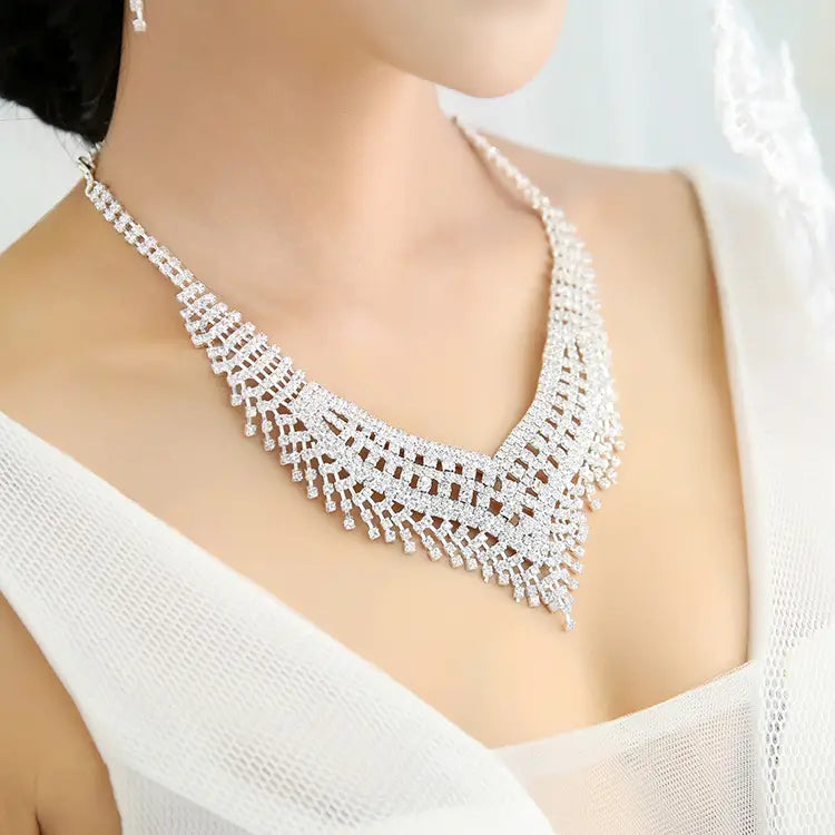 silver tiara featuring a sparkling silver diamond necklace with an intricate geometric design and cascading fringe of crystals on an american rhinestone claw chain large.