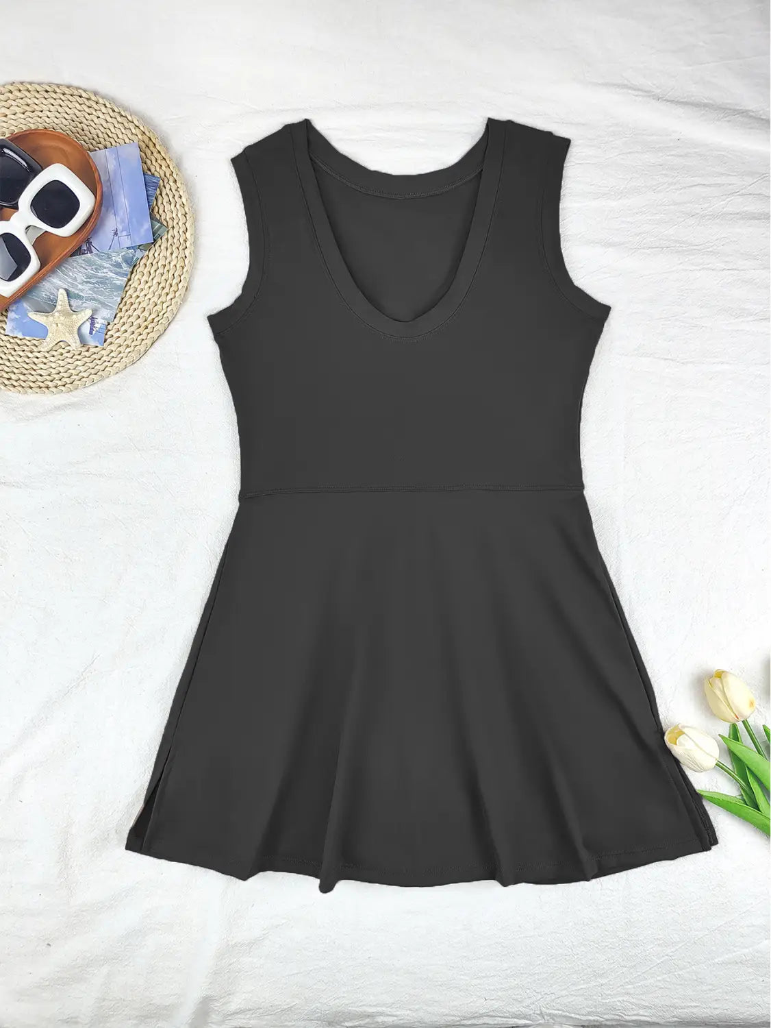 black sleeveless v-neck flared yoga tennis skirt made of smooth stretchy fabric with side slit for tennis skirt sport and skirt sport dress activities