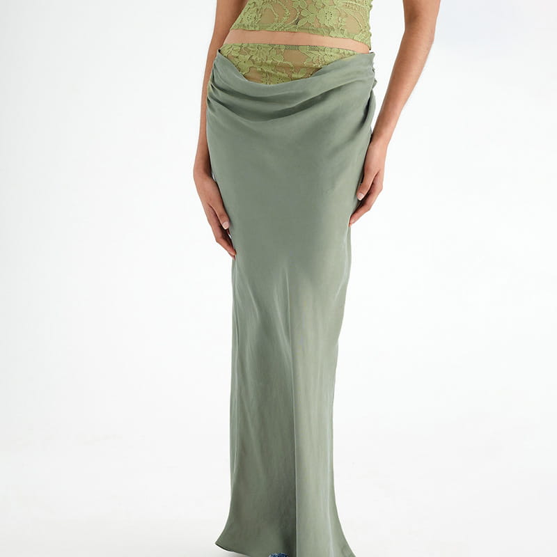 a flowing olive green satin skirt with a draped high-waisted design paired with a sage green lace backless tube featuring sling stitching ruffle and stitching ruffle hip details