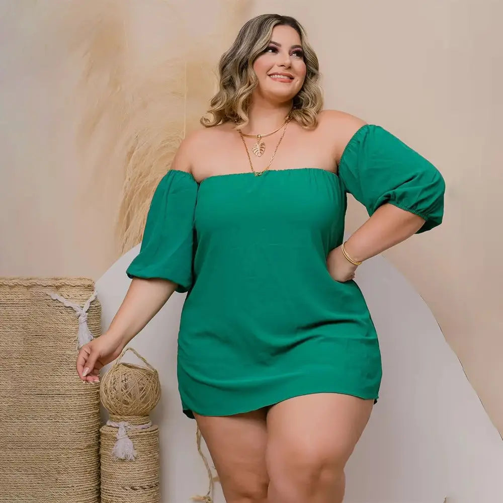 plus size ladies emerald green off the shoulder dress with puffed sleeves and a relaxed fit complementing size ladies lace up two piece set for stylish comfort with stretch shorts.