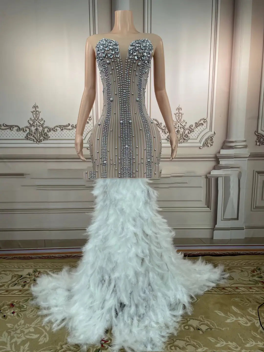 a glamorous silver beaded mermaid bar sleeveless long gown with a feathered white train designed for hips nightclub bar use