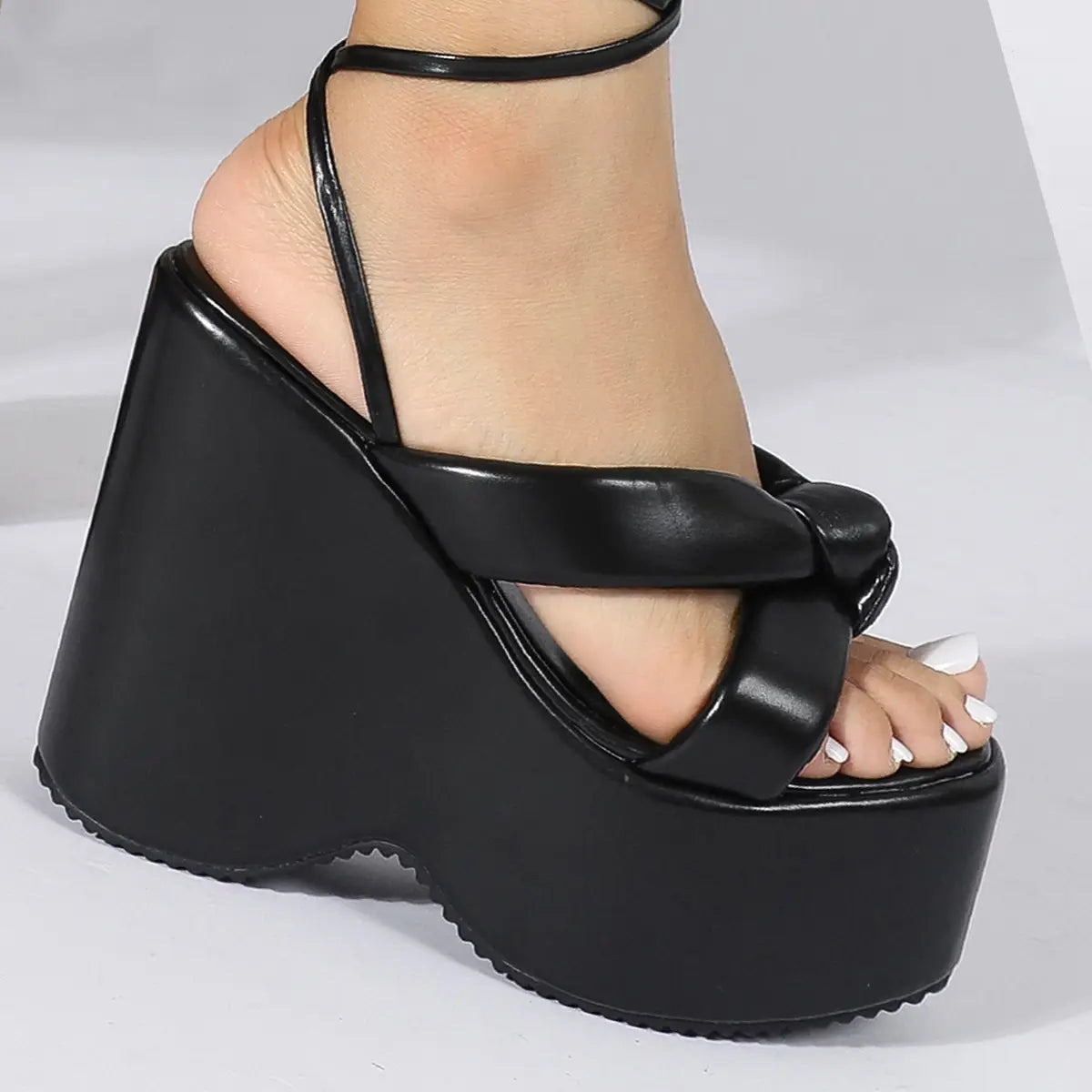 black platform wedge high heel sandal with thick glossy sole and ankle strap featured in a pink platform wedge high heel ankle tie sandals product line