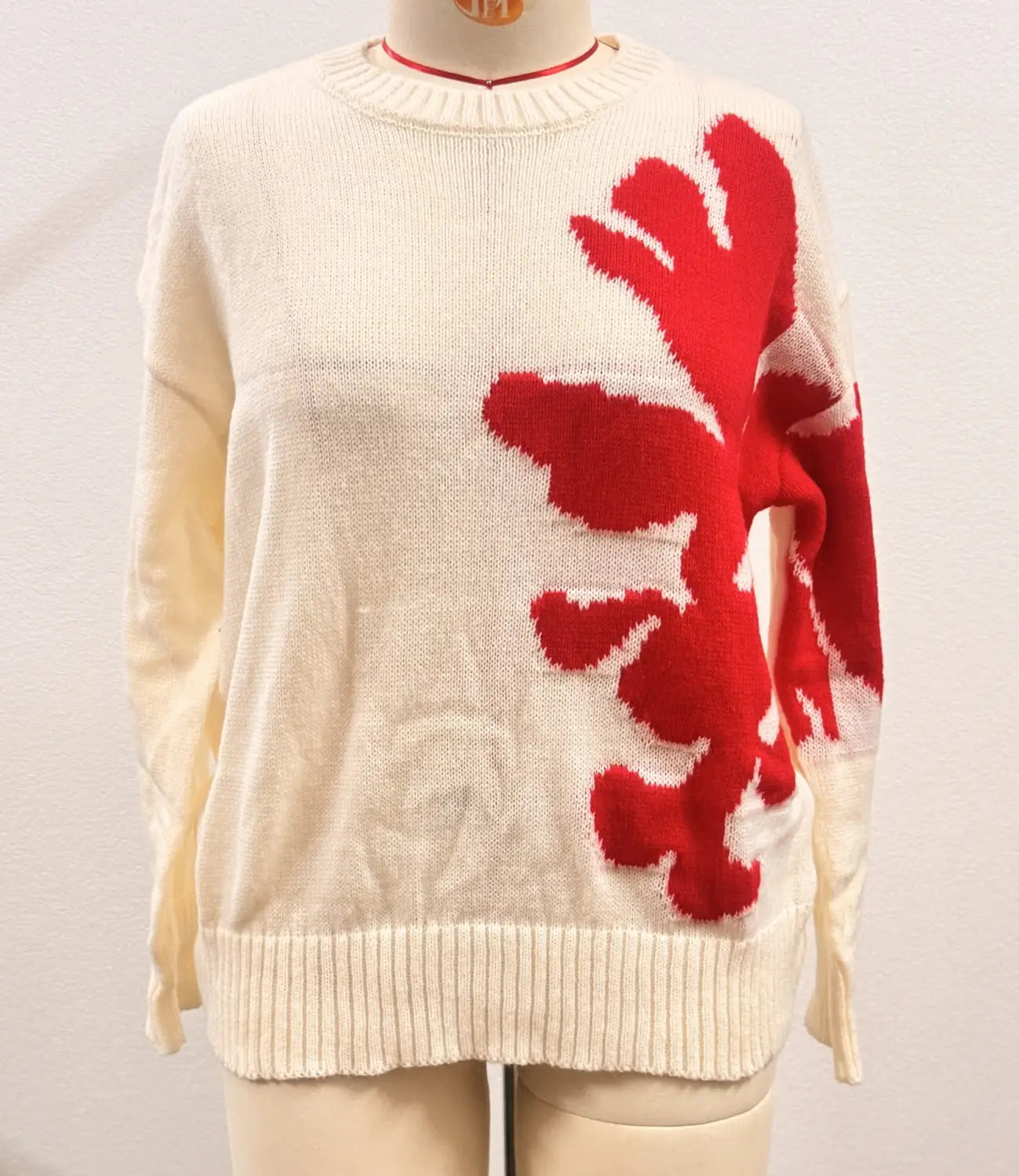 cream-colored knit sweater with bold red coral-inspired graphic featuring christmas 3d floral contrast color on the front in a floral contrast color crewneck design