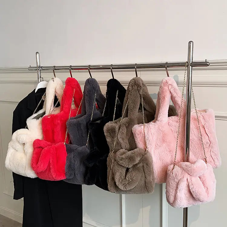 a collection of plush chain plush handbags in white, red, gray, black, brown, and pink featuring faux fur material and winter bags chain straps.