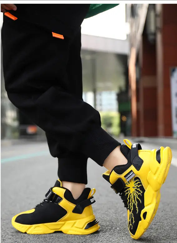 Bright yellow and black winter cotton shoes with waterproof leather uppers and neon orange laces featuring a bold futuristic design and optimized inside length for comfort.
