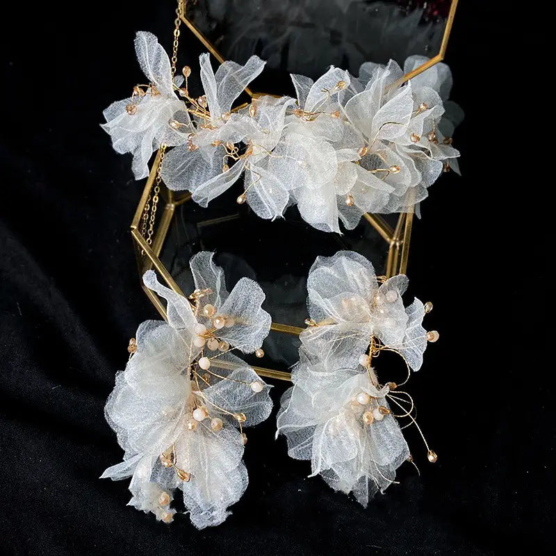 Elegant white organza tulle flower headband earring set adorned with delicate gold wire and pearl-like beads.