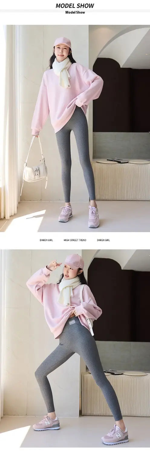 pink oversized sweater with soft loose fit and long sleeves paired with navy blue high waist high elastic threaded underwear leggings for winter threaded underwear use.