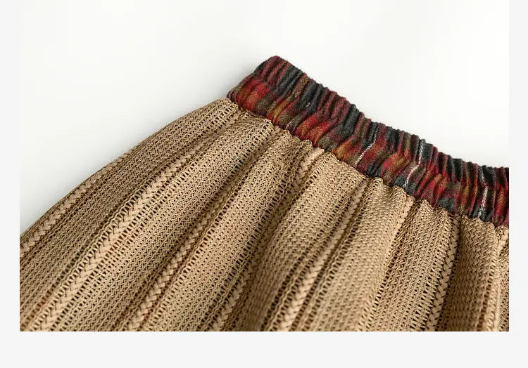 tan knitted retro minority irregular plaid a line skirt with ribbed elastic waistband and red and dark tones pattern