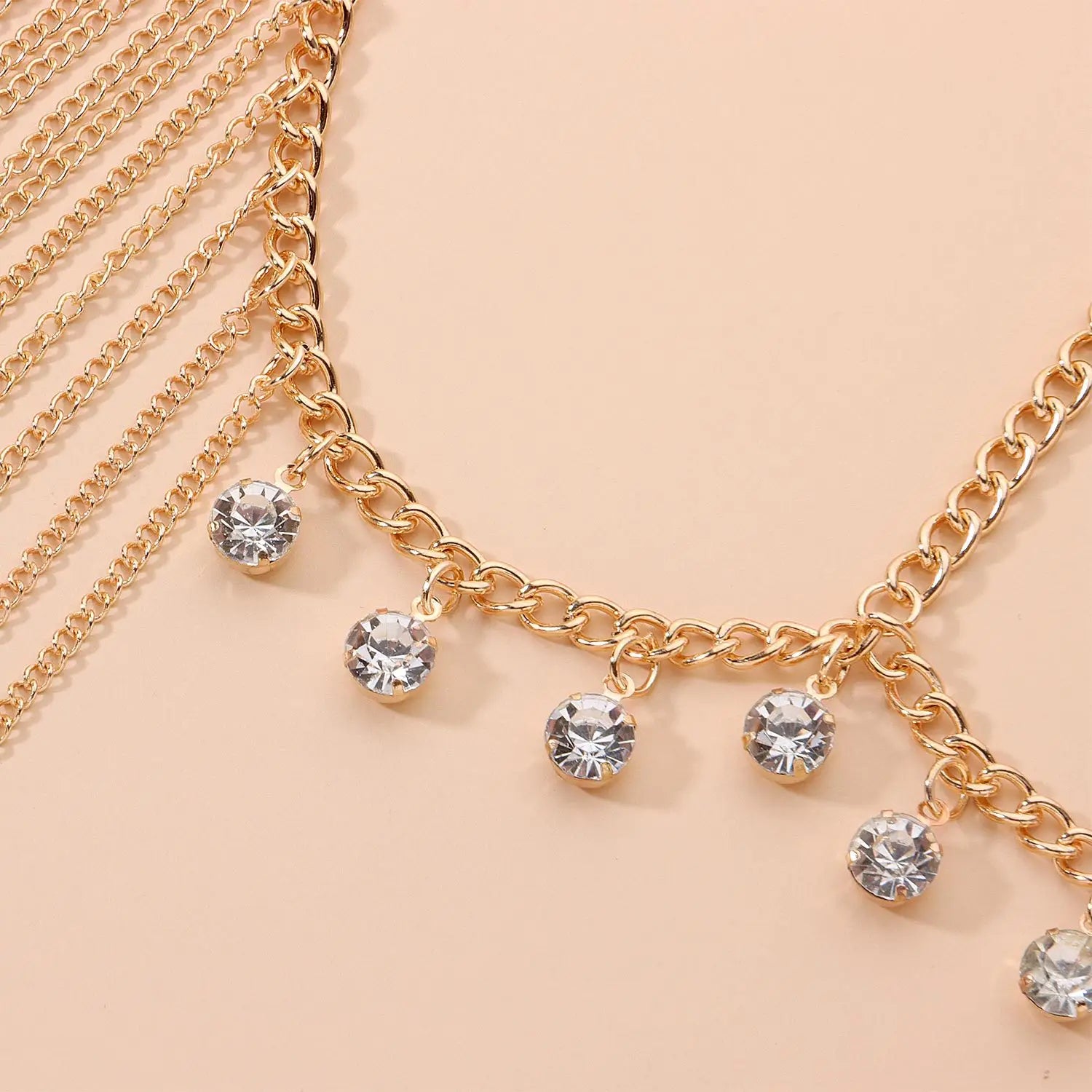 Gold-toned chain body chain with dangling clear crystal charms designed as long tassel head hair accessories female.