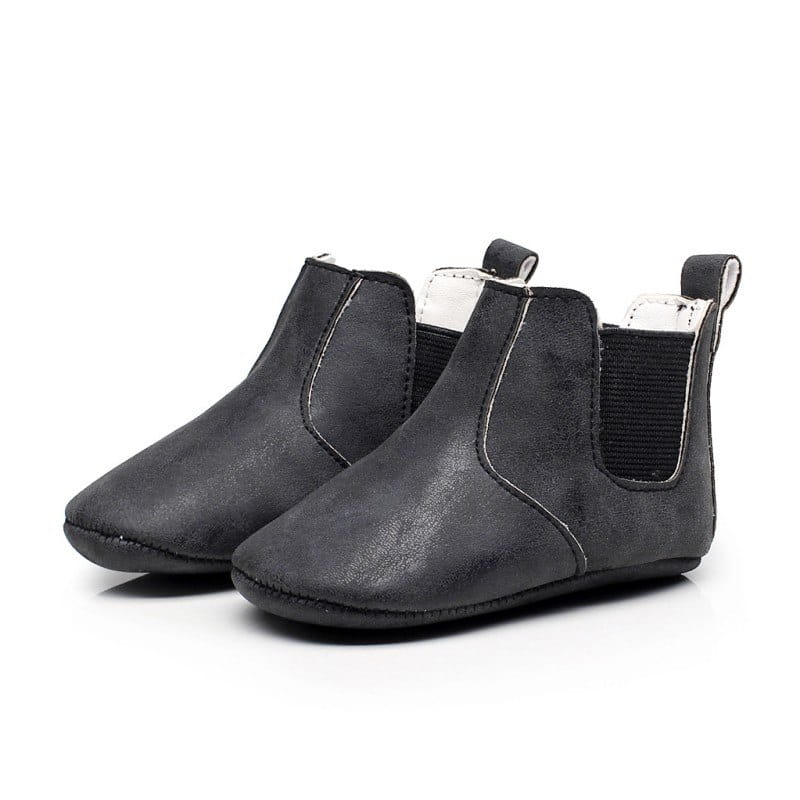 black suede-like baby shoes baby with elastic side panels and white inner lining from the soft suede baby shoes baby xie toddler booties collection