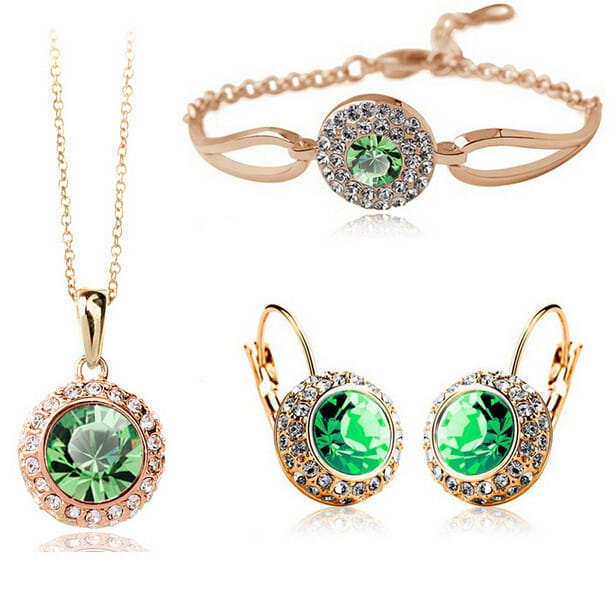 Korean style jewelry set in rose gold tone featuring a central fruit green crystal surrounded by smaller clear crystals on silver pieces.