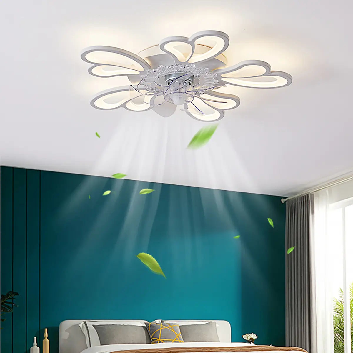 A modern silver-toned ceiling fan with a flower-shaped design and integrated led lighting in a large white framed style.