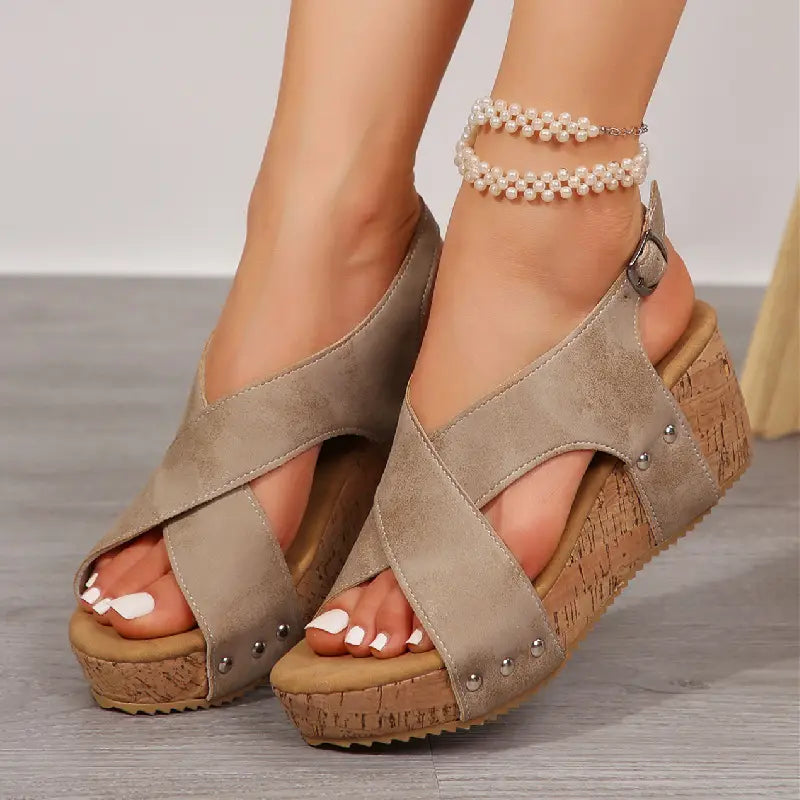 beige suede rivet wedges snadals featuring cork soles and silver studs designed as stylish fish mouth shoes