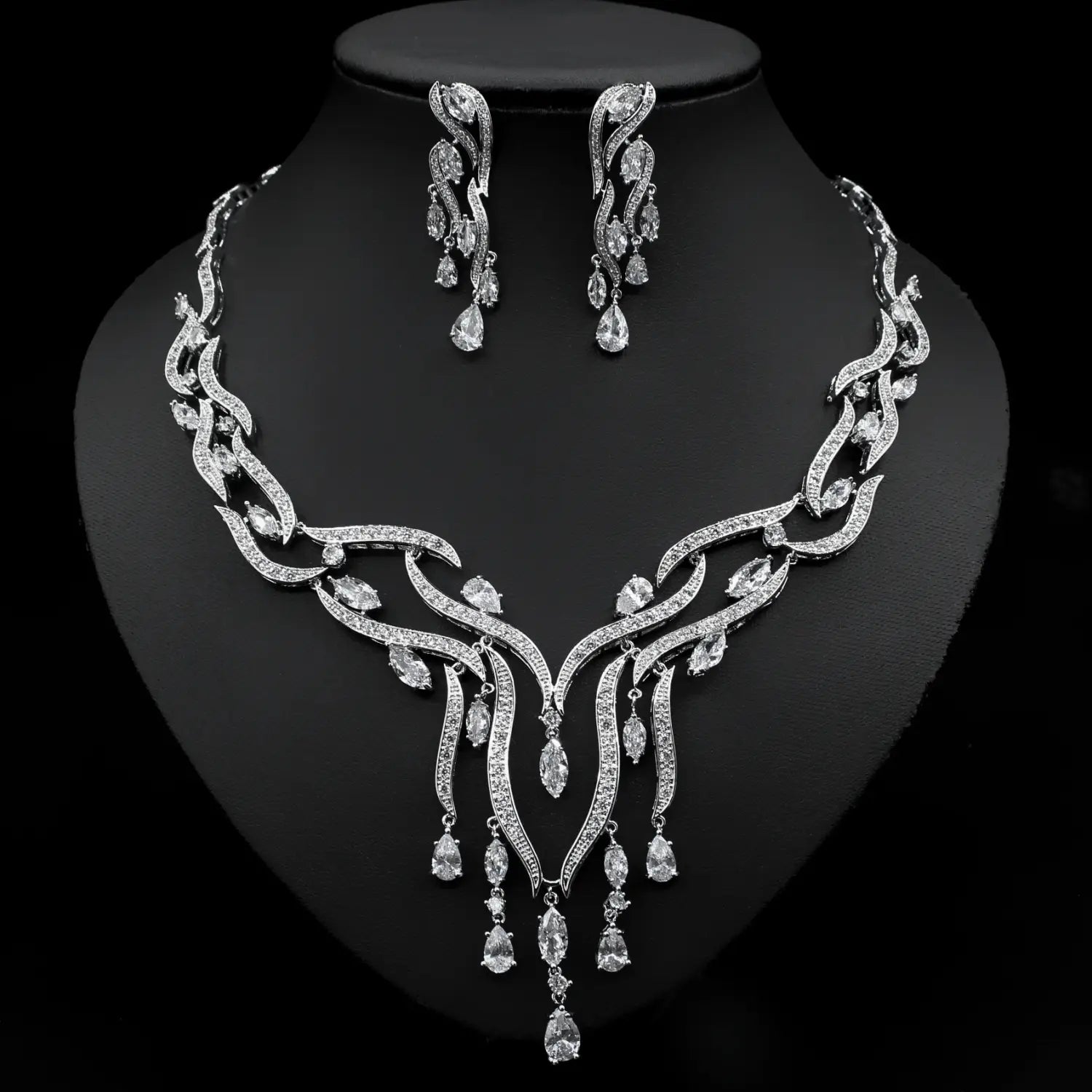 silver-toned emerald green crystal jewelry zircon jewelry set featuring an intricately designed bridal necklace with cascading teardrop crystals and matching earrings